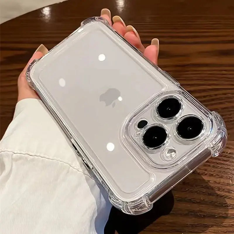 a person holding a clear case with two black lenses