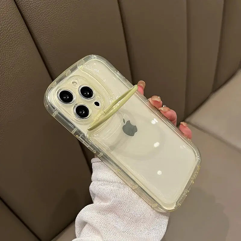 a person holding a clear case with a white phone in the middle