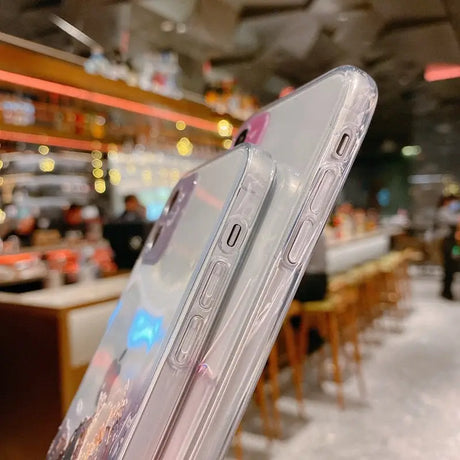 A person holding a clear phone case