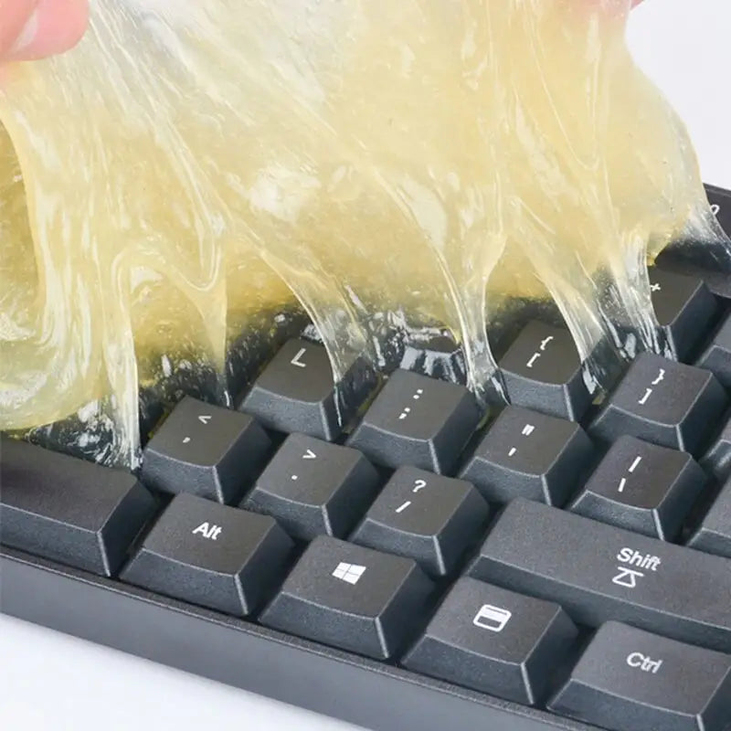 a person is using a plastic bag to put the keyboard keys