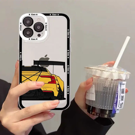 A person holding a cup and a cell phone