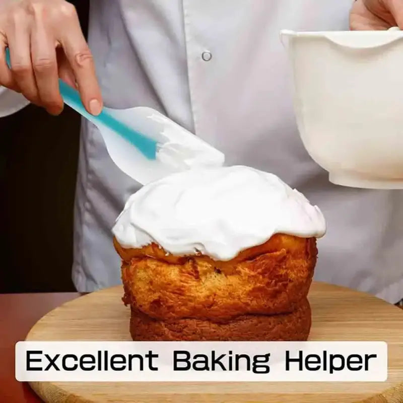 a person is putting a cup of cream on a muffin