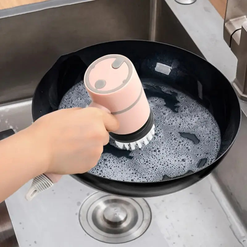 a person is washing a cup in a sink