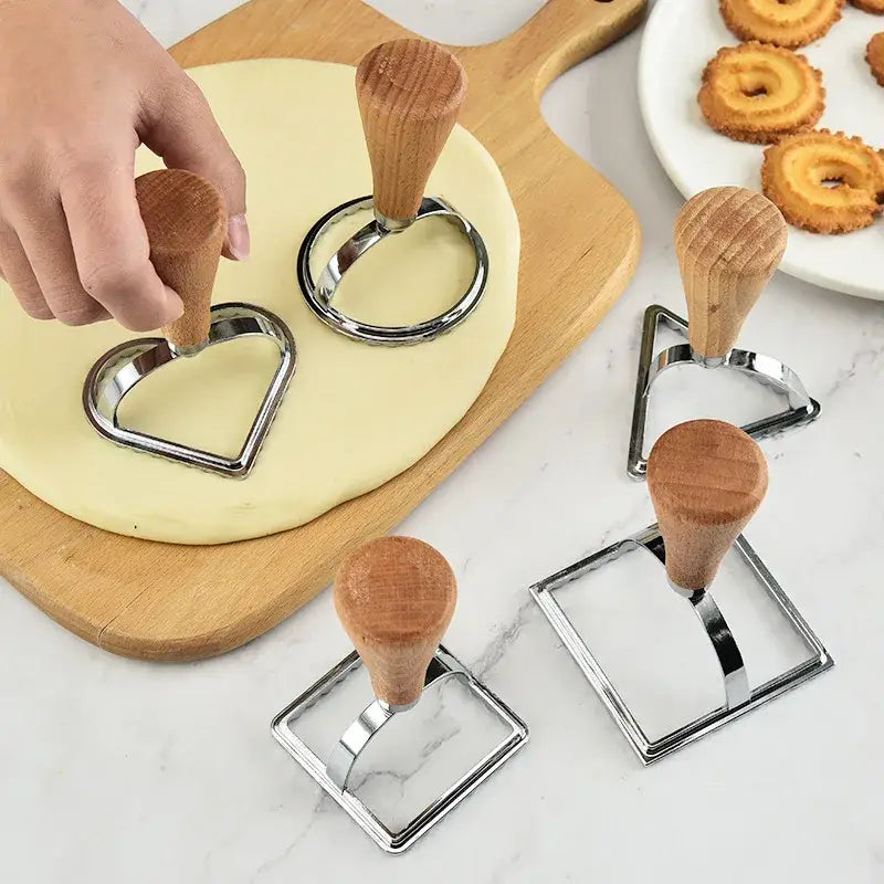 a person cutting dough with a rolling cutter