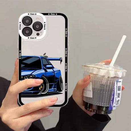 A person holding a drink and a cell case