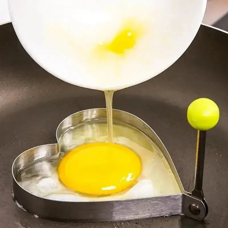 a person is cooking an egg in a pan