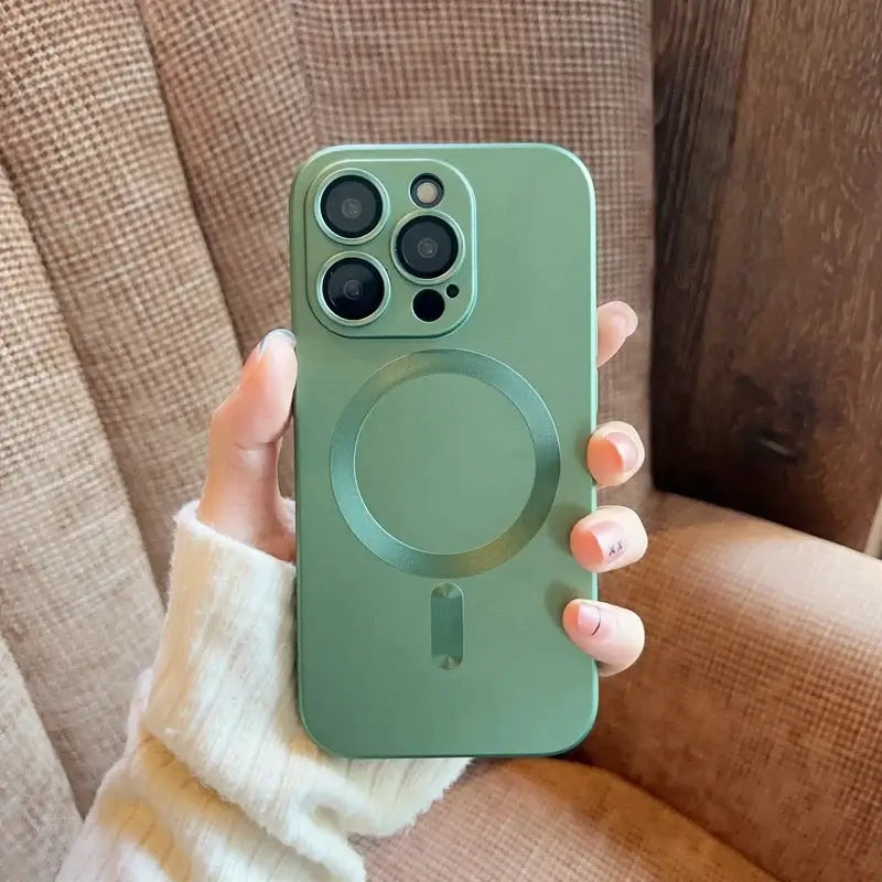 a person holding a green iphone case