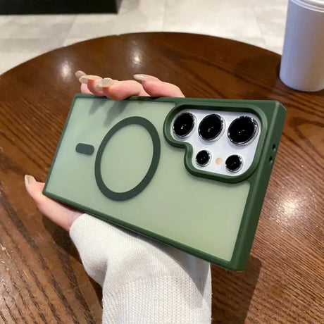 a person holding a green iphone case