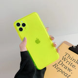 a person holding a green iphone case