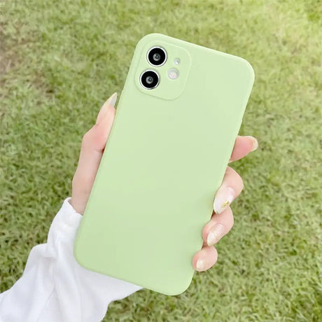 A person holding a green iphone case