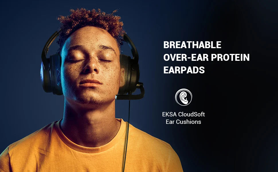 Person wearing green over-ear headphones with closed eyes and curly hair.