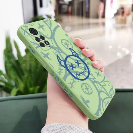 A person holding a green phone case