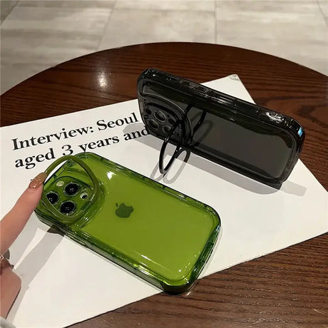 A person holding a green phone case