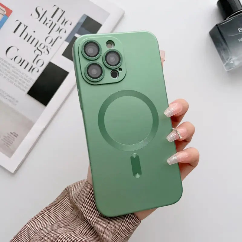 A person holding a green phone case