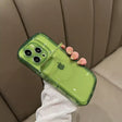 A person holding a green phone case