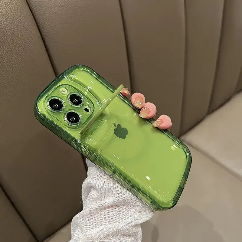 a person holding a green phone case