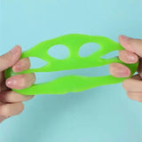 a person holding a green plastic object