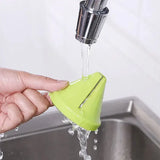 a person is holding a green strainer in their hand