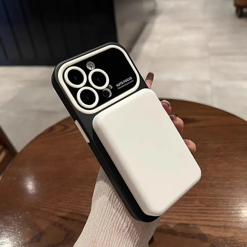 a person holding a white phone case