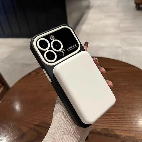 a person holding a white phone case