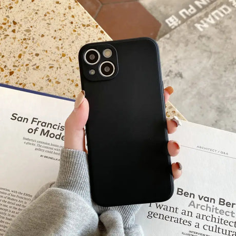 a person holding a phone case in their hand