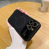 a hand holding a black iphone case with a gold ring