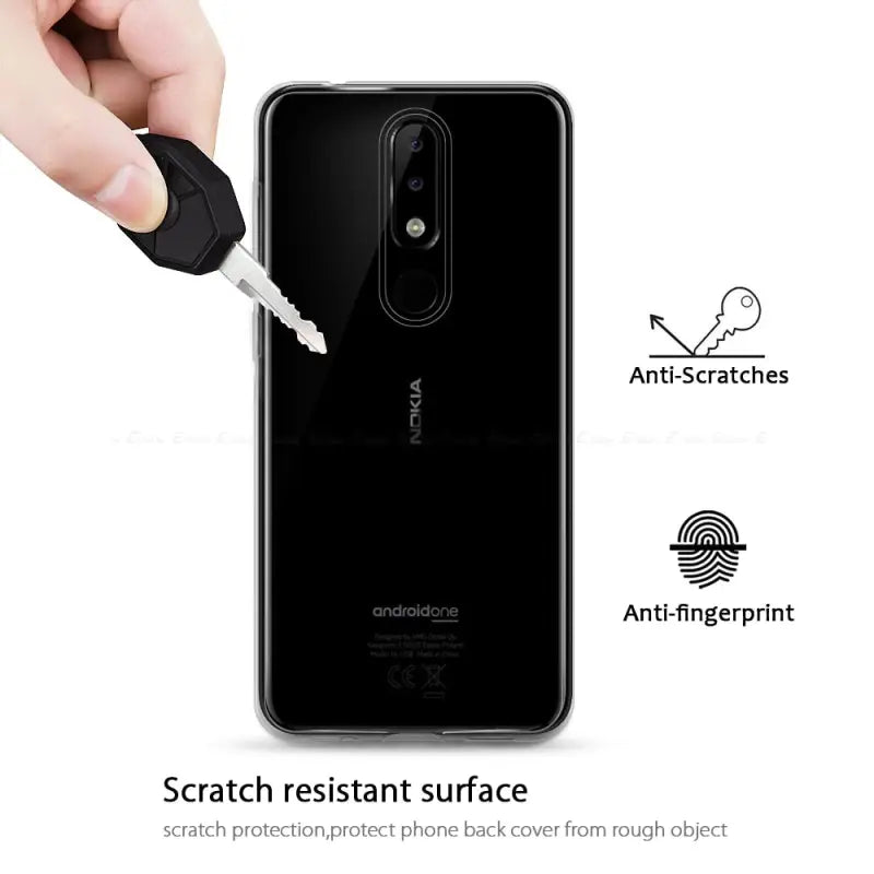 the back of a black phone with a white background and a hand holding a black phone