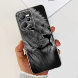 a hand holding a phone case with a black and white lion