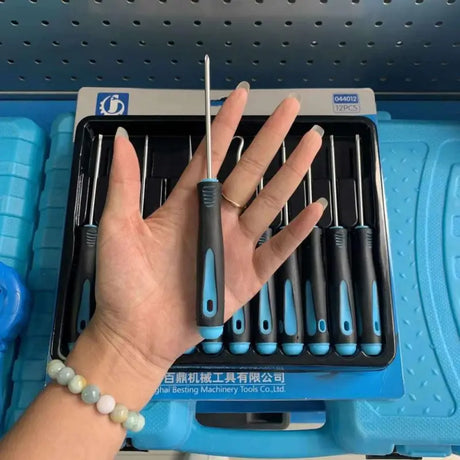 a person holding a blue nail brush in their hand