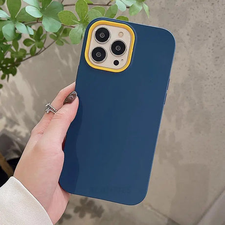 a person holding a blue iphone case