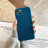 a person holding a blue iphone case