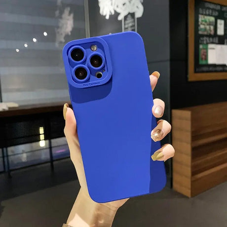 a person holding a blue iphone case