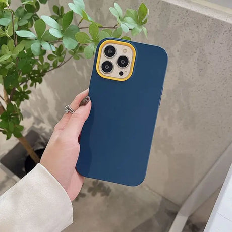 a person holding a blue iphone case