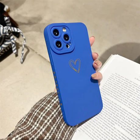 a person holding a blue phone case