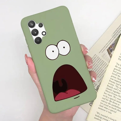 a person holding a book and a phone case