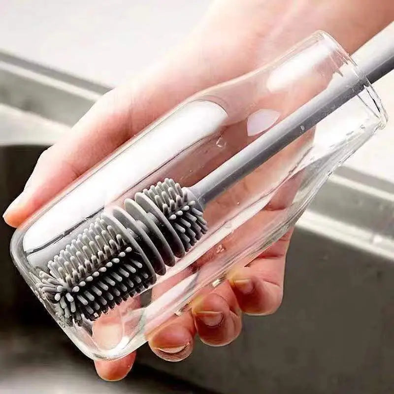 a person holding a brush in their hand