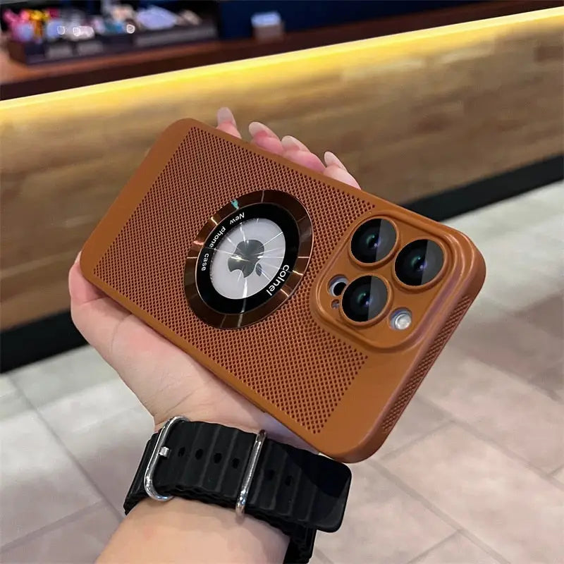 a person holding a brown iphone case
