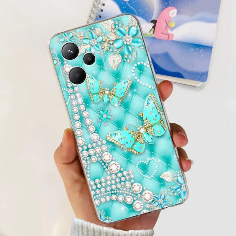 someone holding a phone with a blue case with a butterfly design