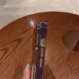 a woman holding a purple lighter in her hand