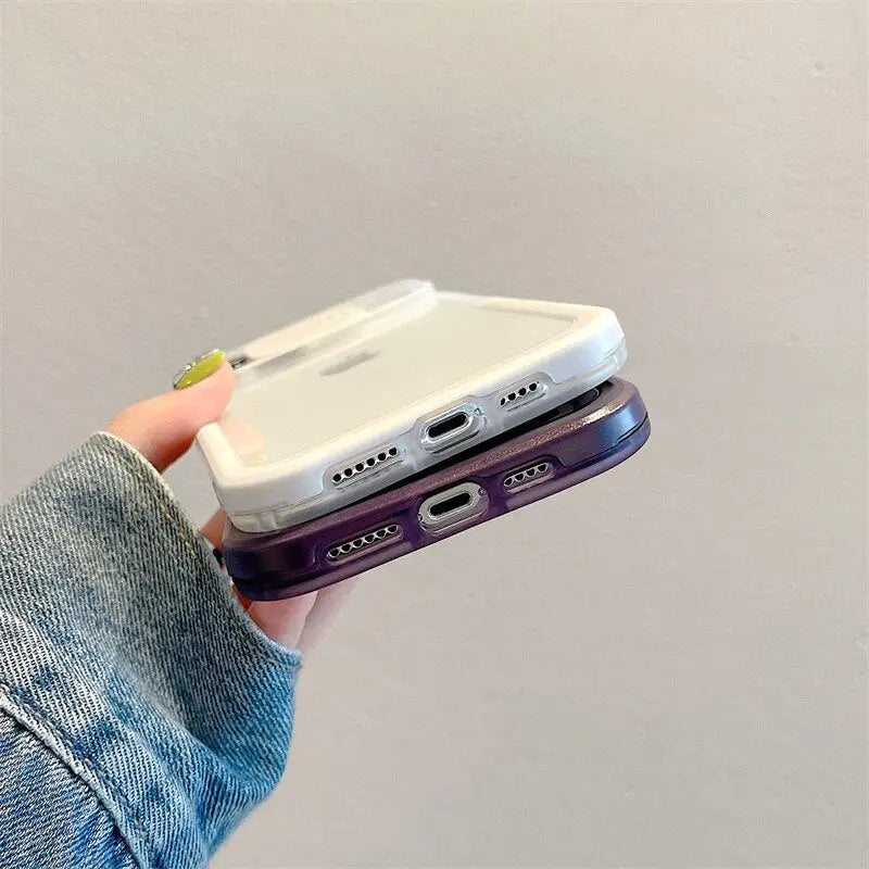 a hand holding a white and purple phone