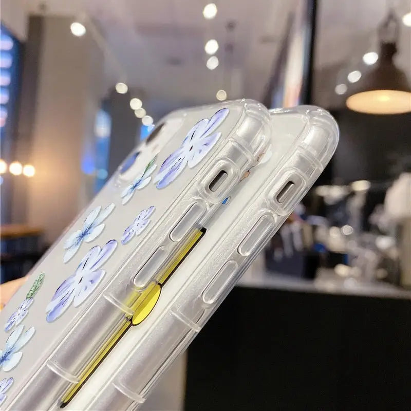 a clear case with a yellow handle