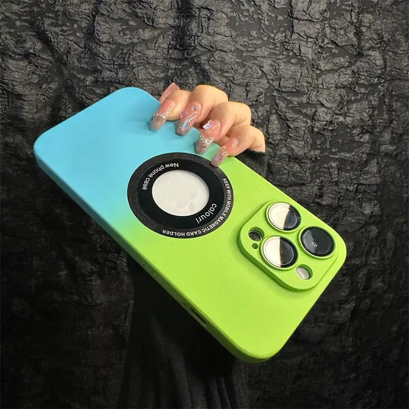 a person holding a green and blue phone case