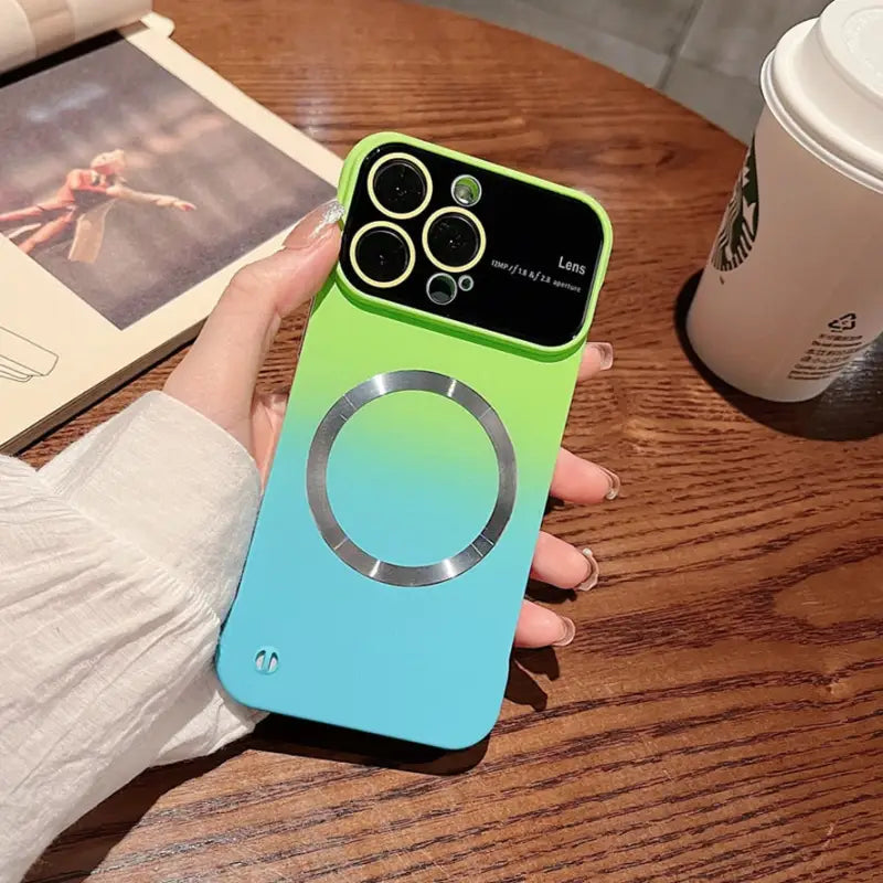 a person holding a green and blue phone case