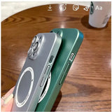 a person holding a green phone with a camera