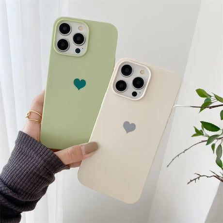 a person holding a green iphone case