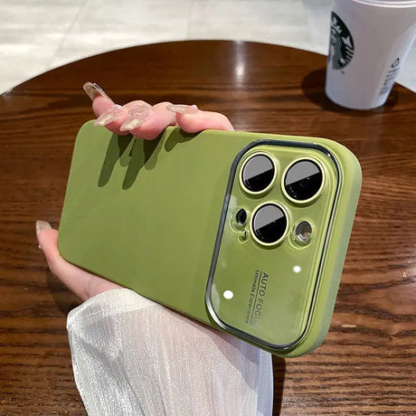 a person holding a green iphone case