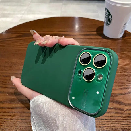 a person holding a green iphone case