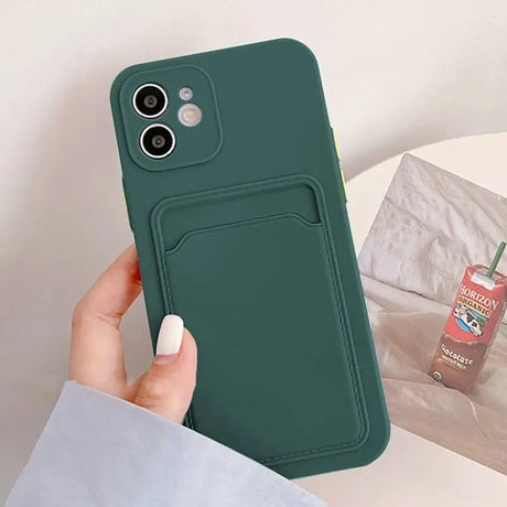 a person holding a green phone case