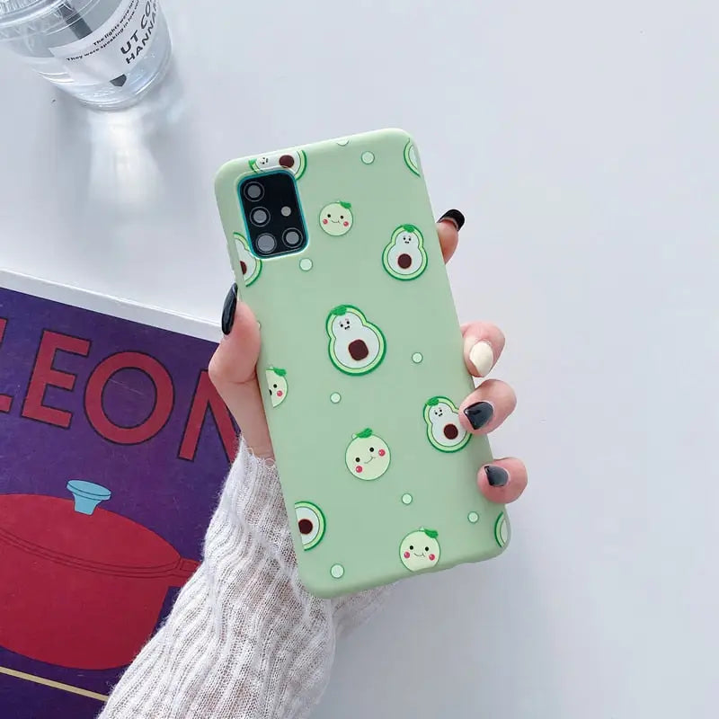 a person holding a green phone case