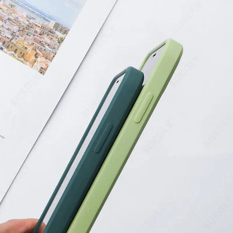 a person holding a green phone case